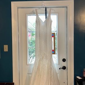 This is a pageant/prom dress. Size zero, with feathers and iridescent sparkles!